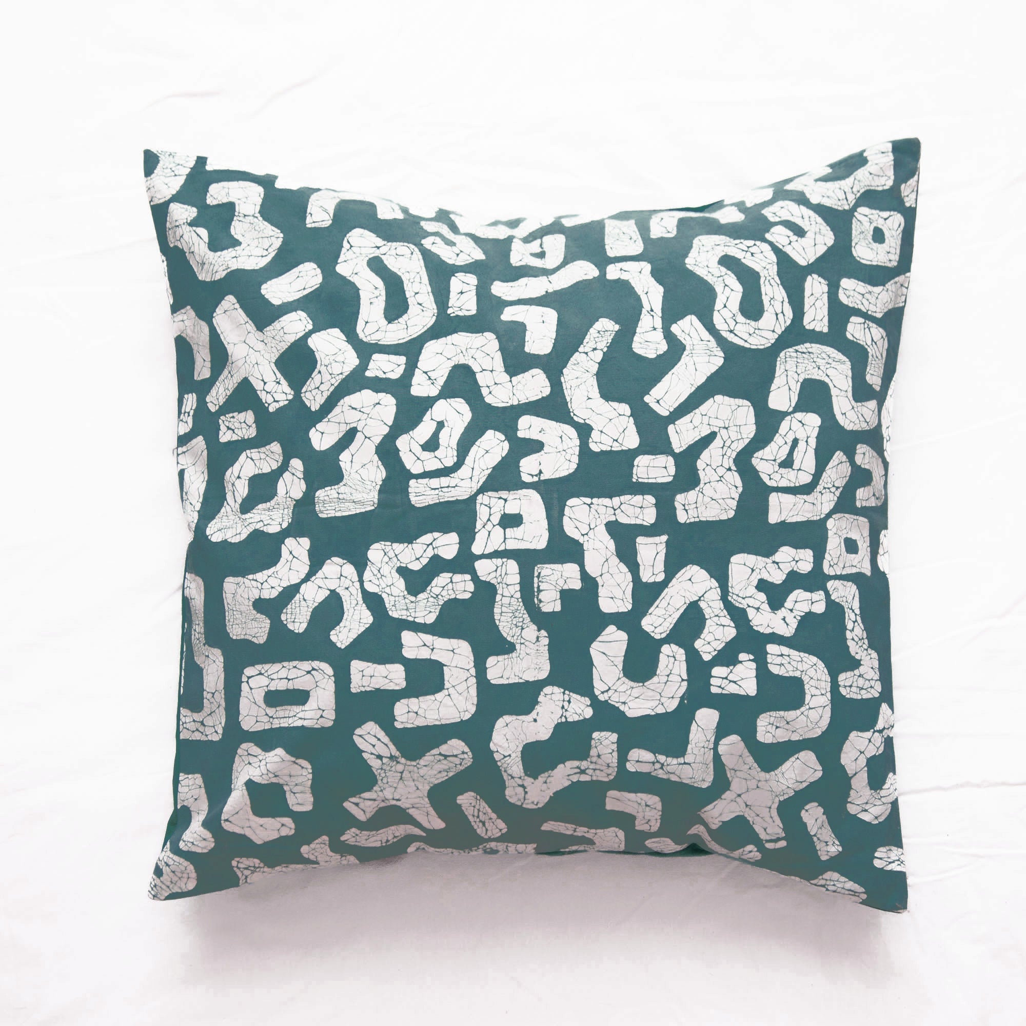 Hand-painted teal cushion cover, made from locally sourced fabrics to look good and do good.