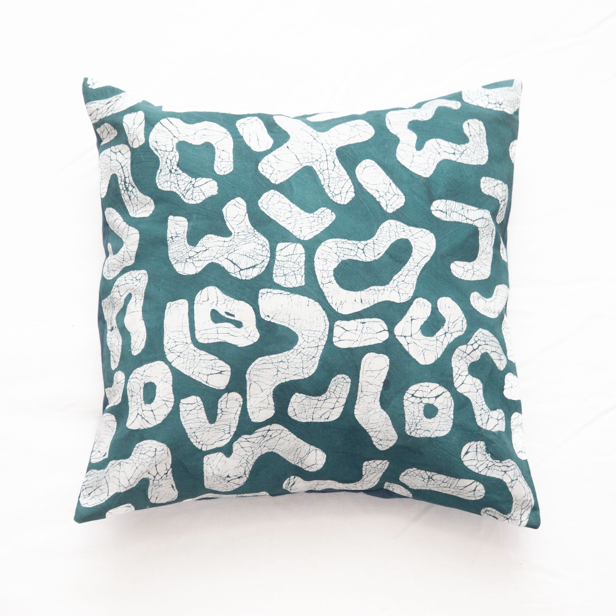 The perfect teal cushion cover adorned with intricate African Kuba patterns, made from 100% cotton.