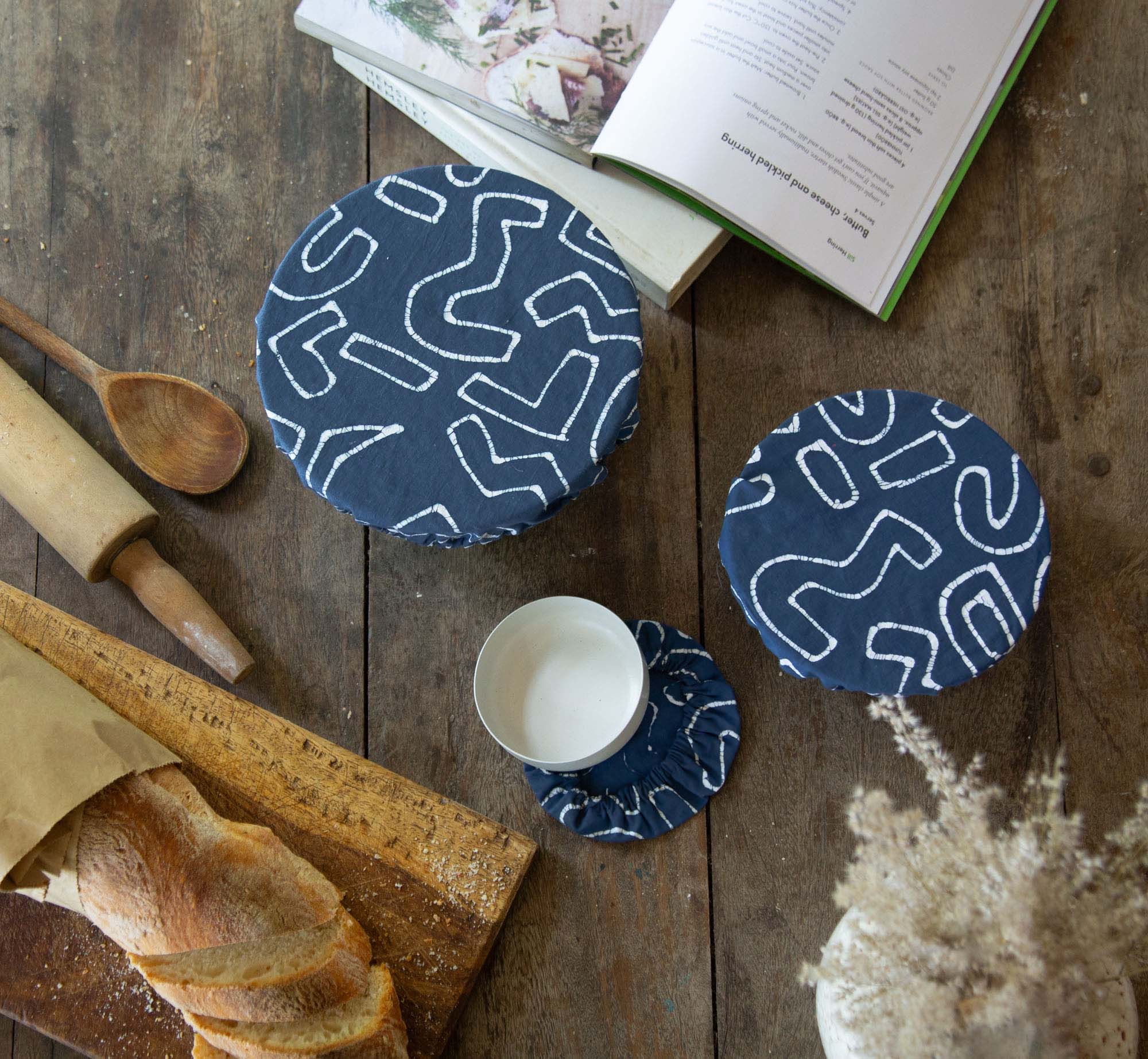 Keep your food fabulously fresh with our indigo bowl covers adorned with an African inspired squiggle pattern.