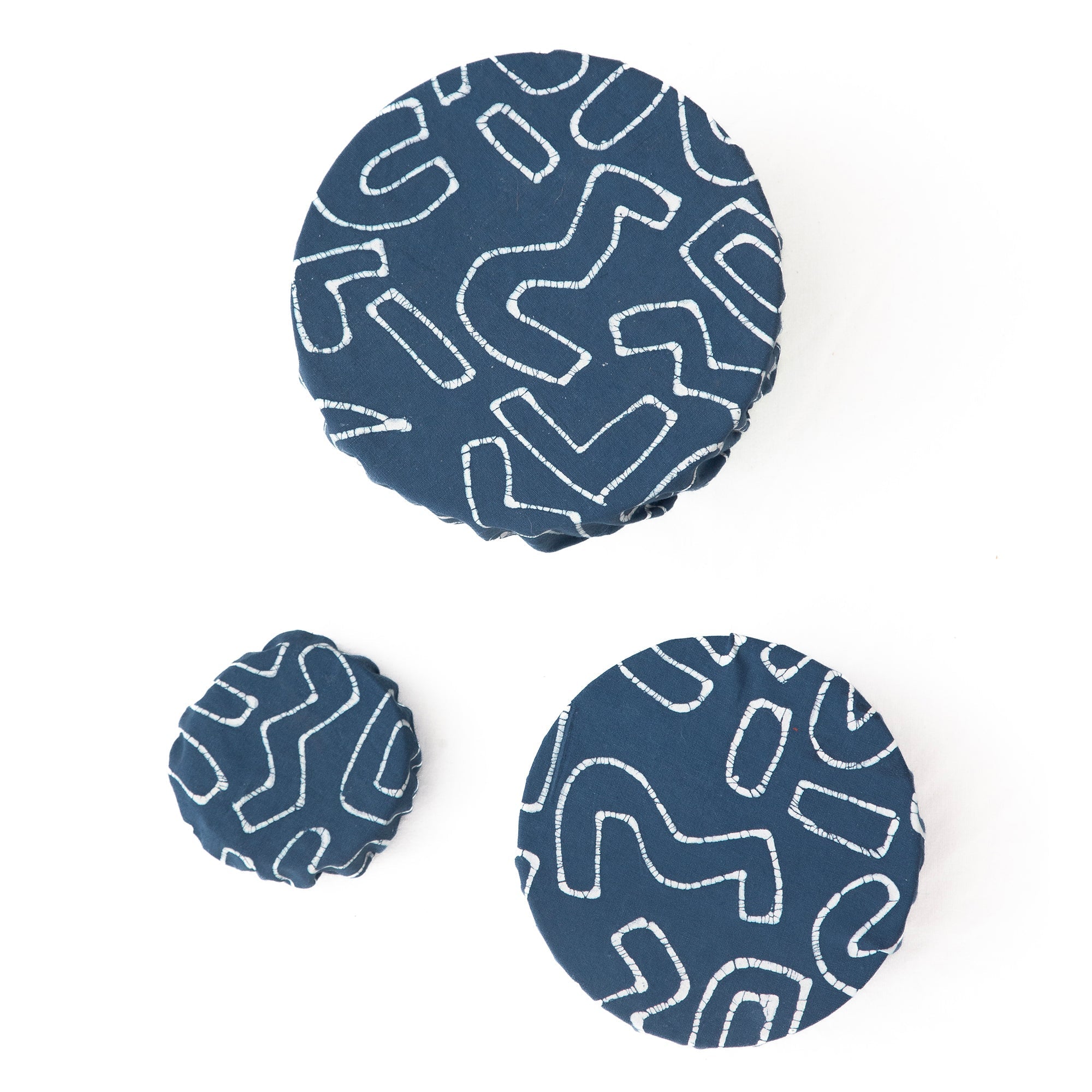 African made indigo blue bowl covers, adorned with a squiggle pattern and made from 100% cotton.