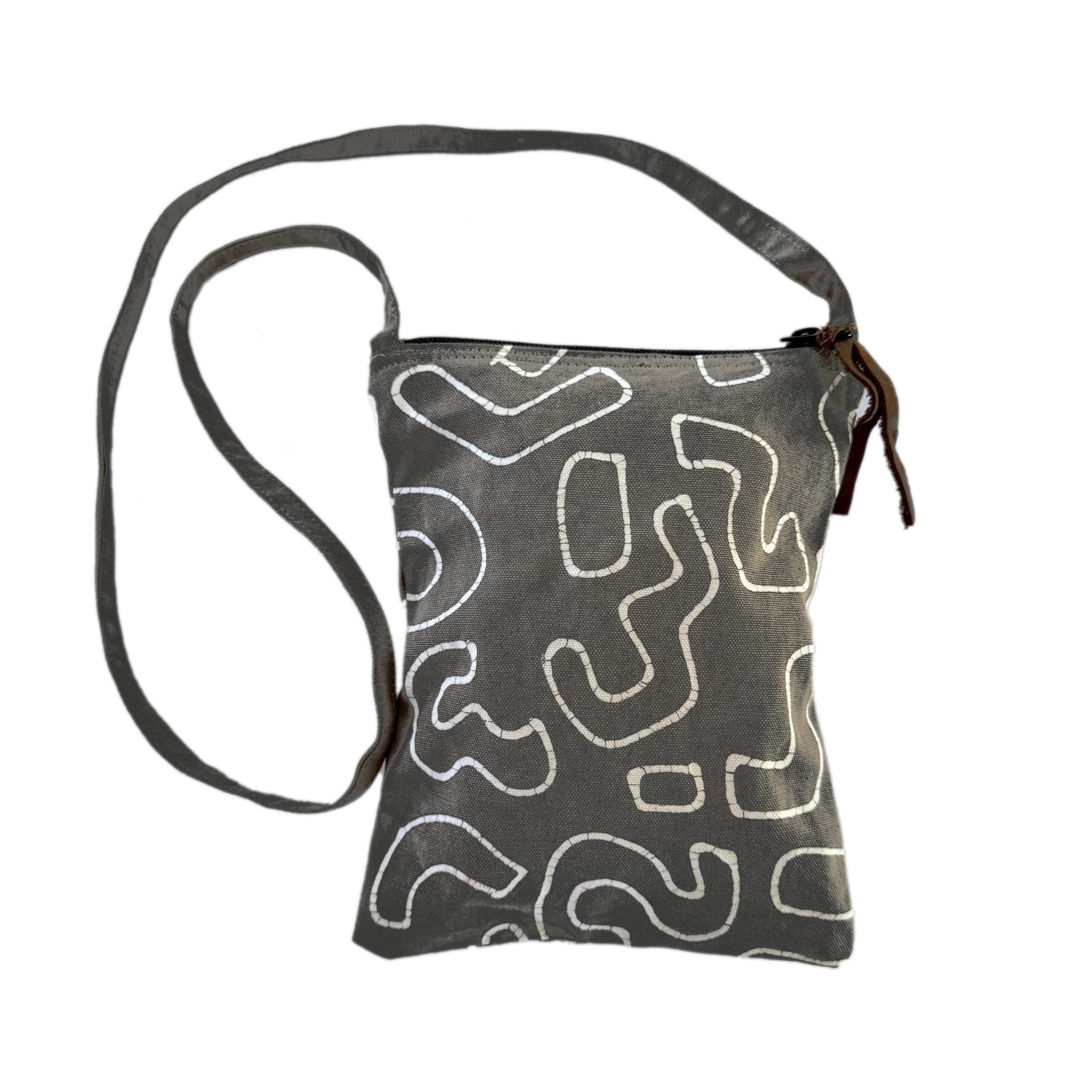 The perfect bohemian chic passport bag, in a charcoal colour with a tradition Batik technique to create our squiggle pattern.