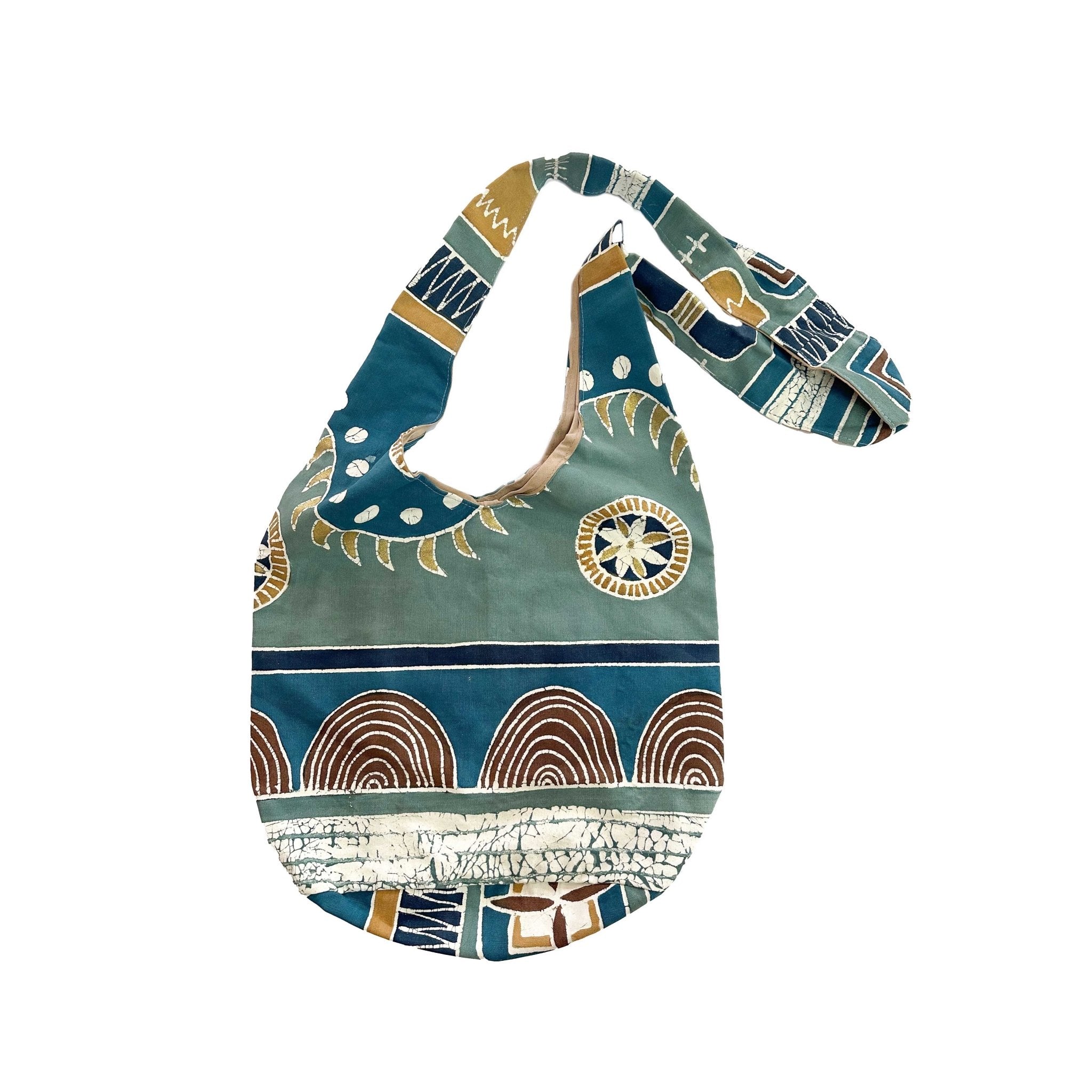 Sustainably hand painted and batik sling cross body bag in blues and neutral colours in organic cotton