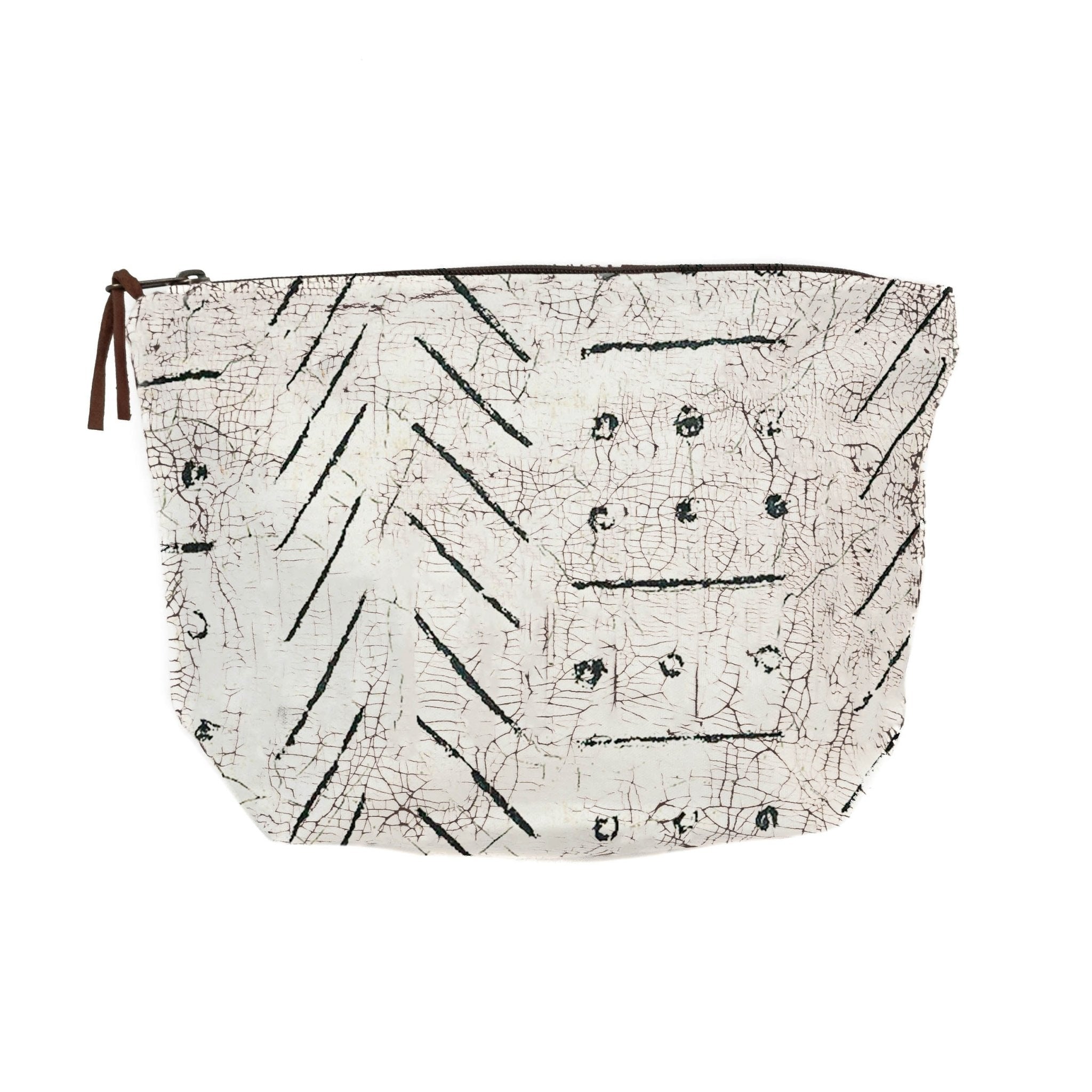 Travel in sustainable style with our white wash bag, adorned with African inspired black geometric pattern.