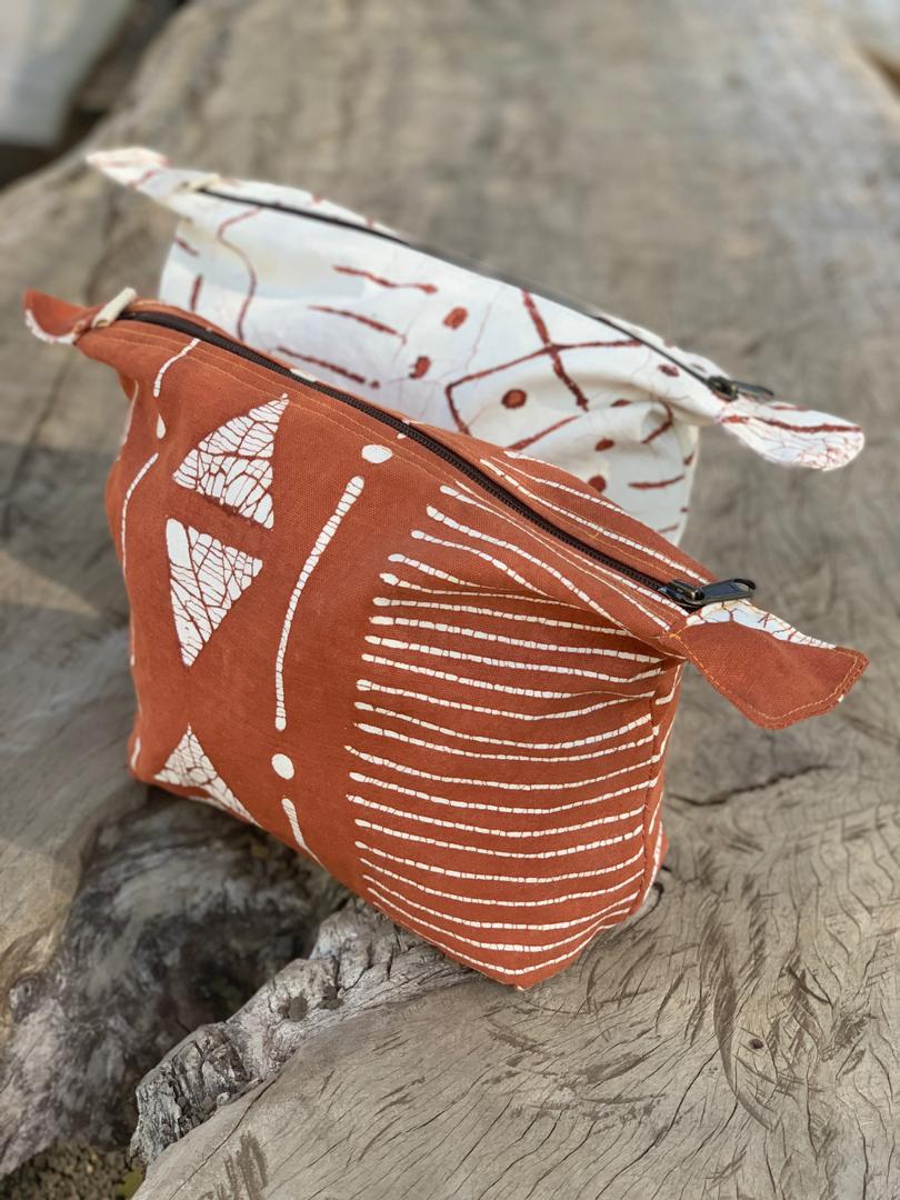 Sustainably stylish red wash bag, adorned with fashion forward patterns to add bohemian elegance to your bathroom.