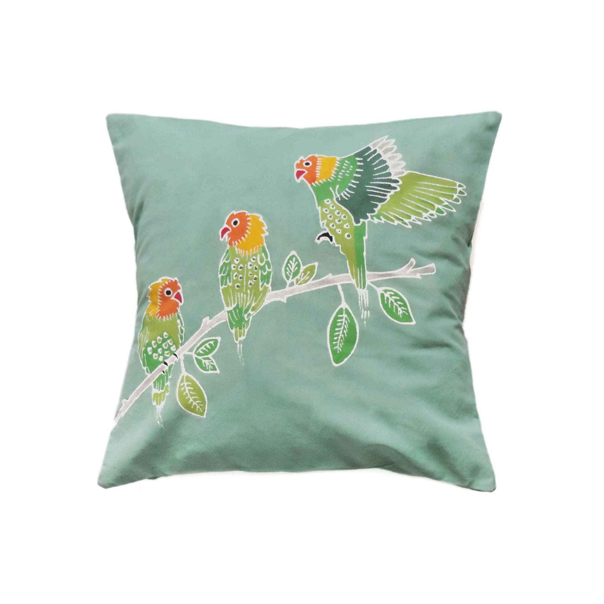 Perfect light green cushion cover adorned with colourful lovebirds, which bring a stylish and sustainable nature feature.