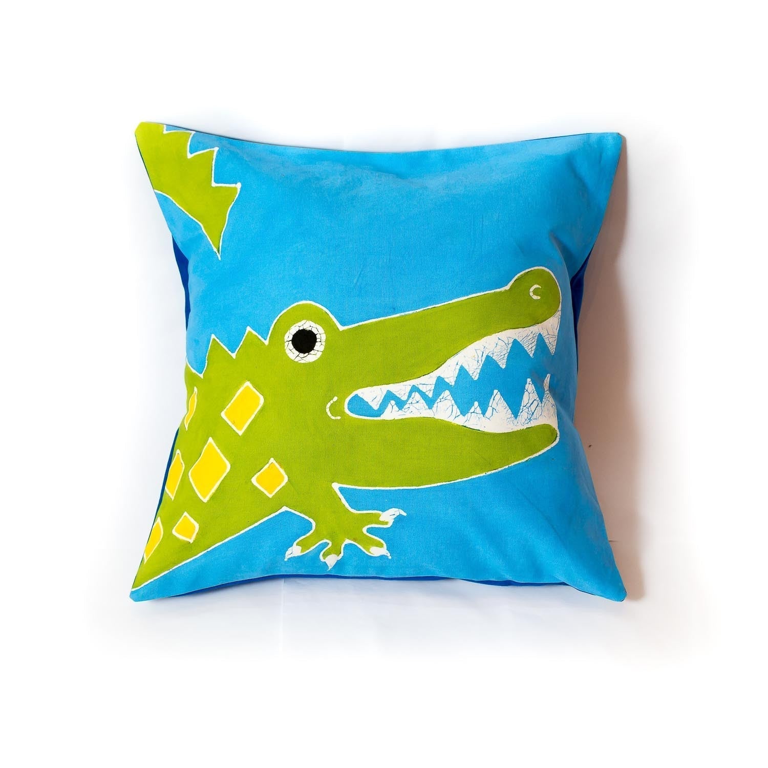 Children's bright green and blue cushion cover, adorned with a hand-painted crocodile to bring vibrancy to your kids bedroom.